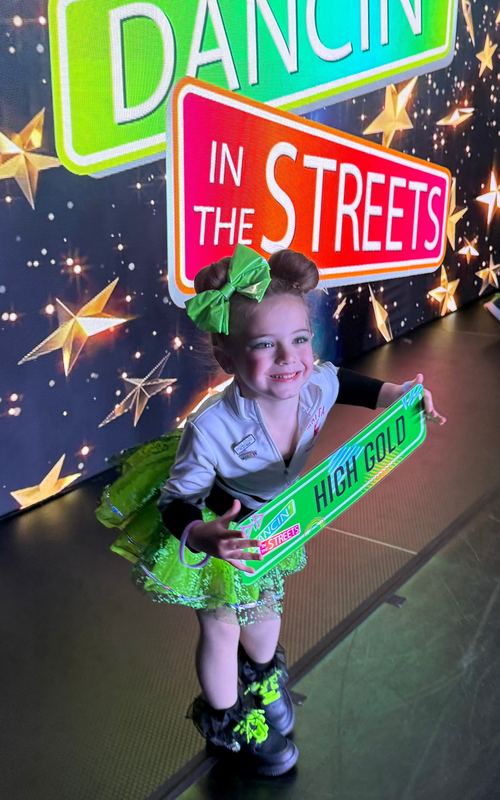 Matta Dance Academy dancer celebrating a High Gold award at Dancin' in the Streets